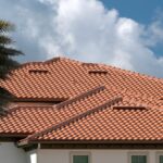 Tiled roof covering of condo building in Florida. Closeup of house rooftop covered with ceramic shingles